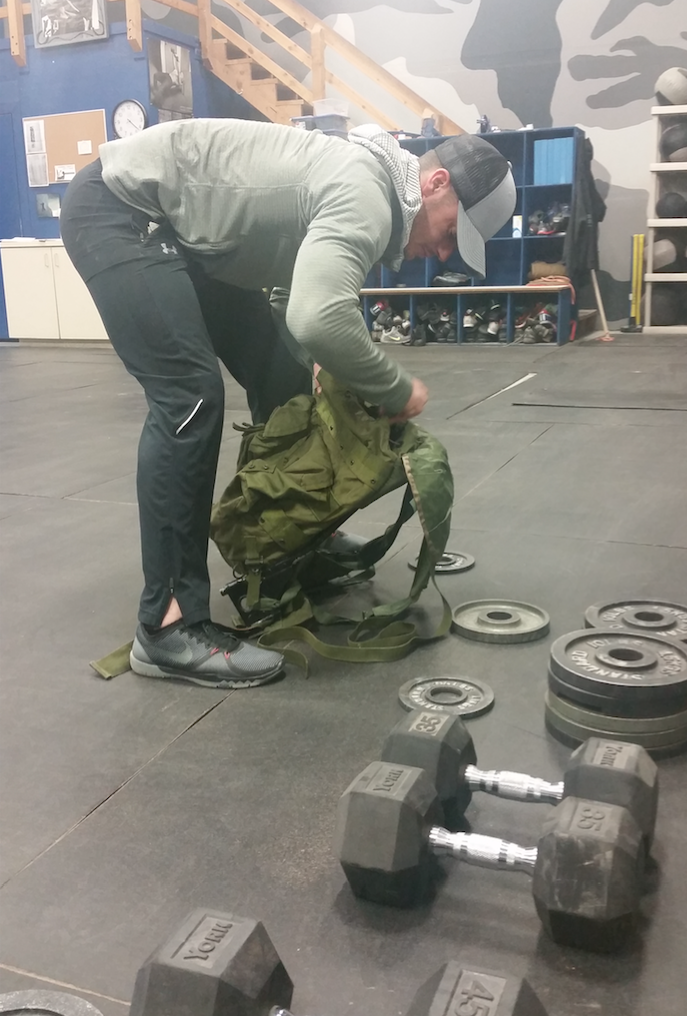 Lab rat loads his pack prior to treadmill trial